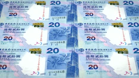 Banknotes-of-twenty-dollars-of-Hong-Kong-rolling,-cash-money,-loop