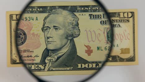 Approaching-using-a-magnifying-glass-ten-dollar-bill