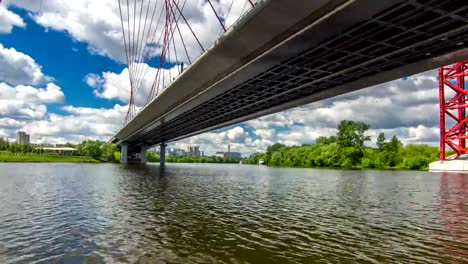 Boats-floats-on-the-Moskva-River-past-the-Zhivopisny-Bridge-and-other-famous-places-timelapse-hyperlapse,-Russia