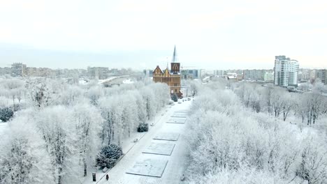 Aerial:-The-Cathedral-in-the-snow-capped-city-of-Kaliningrad,-Russia