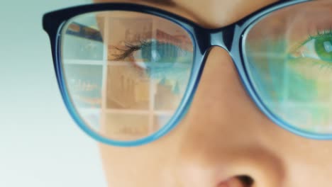 woman-using-the-social-media-channel-with-an-animated-screen-reflection-displayed-in-her-glasses