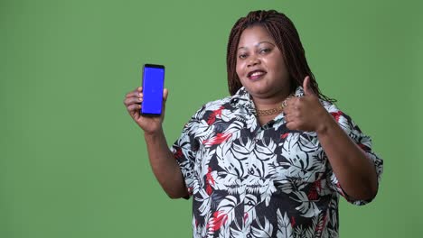 Overweight-beautiful-African-woman-against-green-background