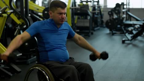 Handicapped-Man-in-Wheelchair-Training-with-Dumbbells