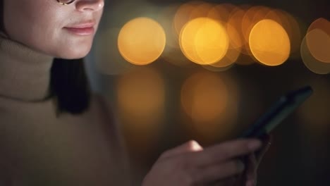 Woman-Typing-on-Smartphone-in-Darkness