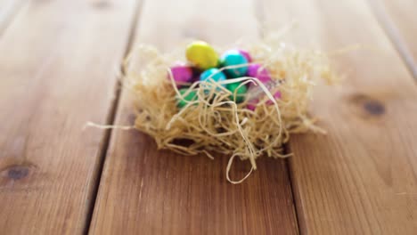 chocolate-easter-eggs-in-straw-nest-on-table