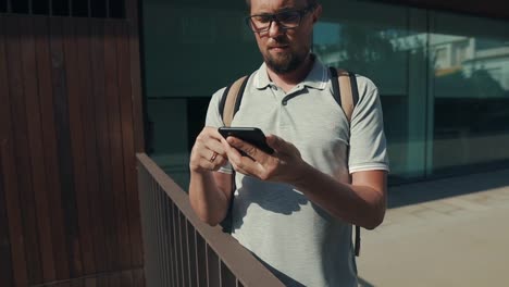 Simple-guy-texting-message-outdoor.