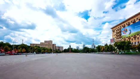 Pedestrians-walk-on-Freedom-Square-at-sunny-day-timelapse-hyperlapse-in-Kharkiv,-Ukraine