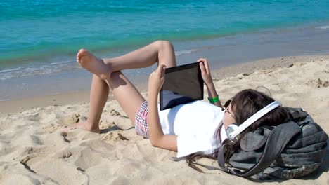 Child-having-rest-on-beach.