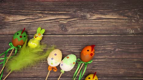 Easter-decoration-appear-on-wooden-background---Stop-motion