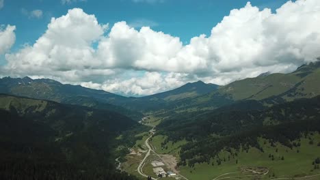 Beautiful-valley-in-Altai-mountains,-aerial-view.-Mountain-taiga,-mountains-in-the-clouds,-Altai