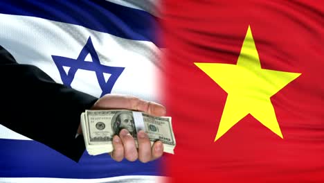 Israel-and-Vietnam-officials-exchanging-tank-money,-flag-background,-partnership