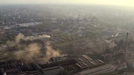 urban-skyline-with-the-smoke-from-the-plant-pipes-above-the-city-buildings