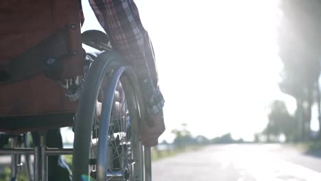 A-Man-in-a-Wheelchair-Walks-on-the-Waterfront