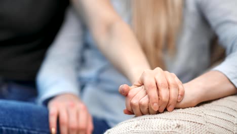 Close-up-female-hand-of-woman-same-sex-couple-touching-showing-tenderness-and-love-feeling