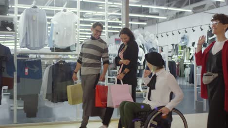 Disabled-Woman-and-her-Friends-in-Shopping-Mall