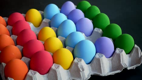 Hands-picking-up-colorful-eggs