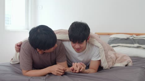 Asian-Gay-couple-kissing-on-bed-at-home.-Young-Asian-LGBTQ-men-happy-relax-rest-together-spend-romantic-time-after-wake-up-in-bedroom-at-home-in-the-morning-concept.-Slow-motion-Shot.