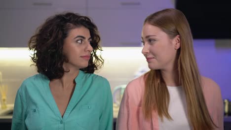 Young-lesbian-couple-looking-at-camera,-female-friends-relationships,-affection