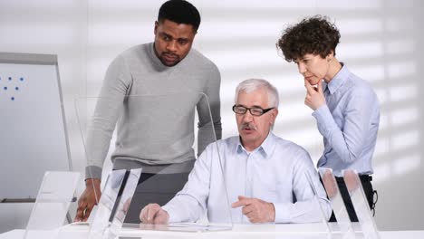 Diverse-Colleagues-Looking-at-Futuristic-AR-Screen-in-Office-and-Smiling