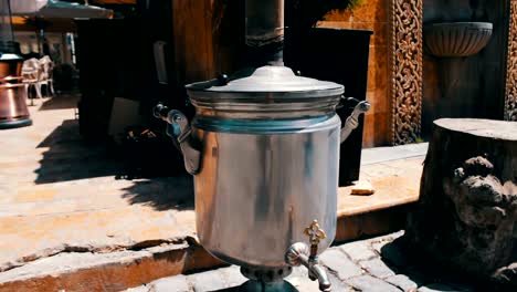 Heated-and-smoking-samovar-stands-on-the-streets-of-Baku,-Azerbaijan