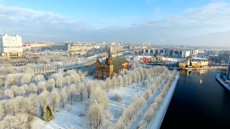 Aerial:-The-Cathedral-in-the-snow-capped-city-of-Kaliningrad,-Russia