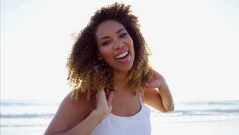 Portrait-of-African-American-female-on-beach-vacation