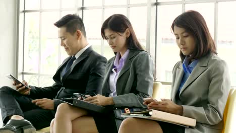 Group-of-Business-people-using-mobile-phone.