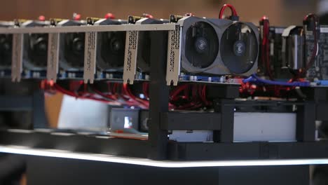 Cryptocurrency-mining-equipment-rig---lots-of-gpu-cards-on-mainboard