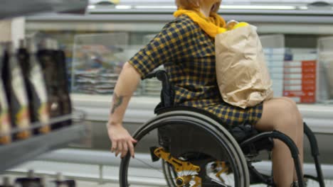 Paraplegic-Woman-Riding-Wheelchair-in-Supermarket