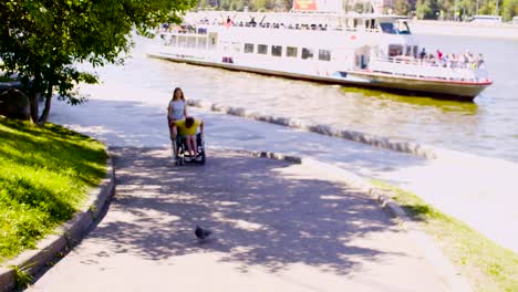 Happy-disable-man-with-his-wife-walking-near-the-river