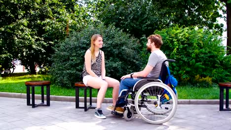 Young-disable-man-with-his-wife-sitting-in-the-park