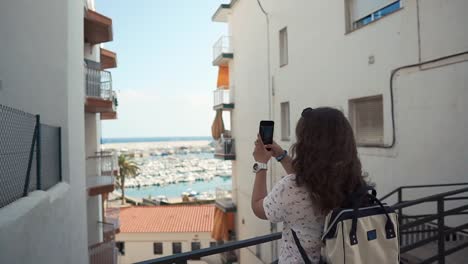 Adult-woman-is-shooting-picturesque-landscape-in-city-by-phone-for-social-nets