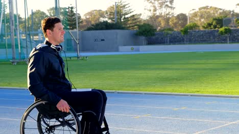 Disabled-athletic-moving-with-wheelchair-at-sports-venue-4k