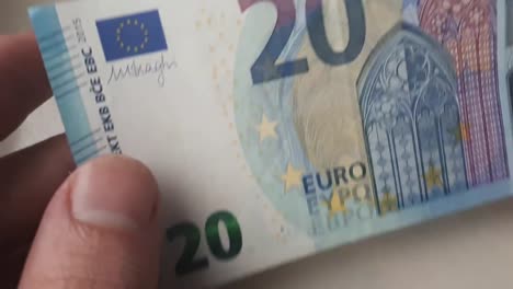 20-euro-banknote-in-the-hands-of-a-guy