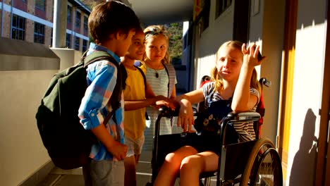 Schoolkids-interacting-with-each-other-in-the-corridor-4k