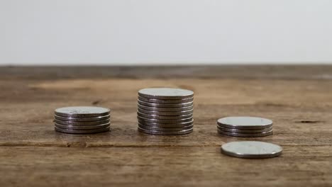 stop-motion-animation-video-footage-of-increasing-coins-stacking-piles