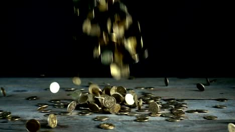 Slow-motion,-a-pile-of-Ukrainian-coins-falls