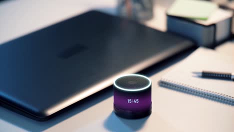 glowing-smart-speaker-with-time-on-desk-at-office