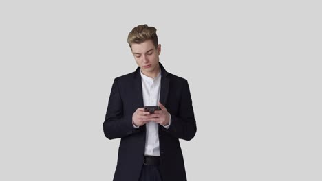 Businessman-text-messaging-on-mobile-phone