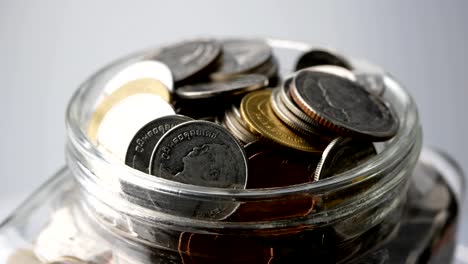 save-money-for-investment-concept-thai-coins-in-a-glass-jar