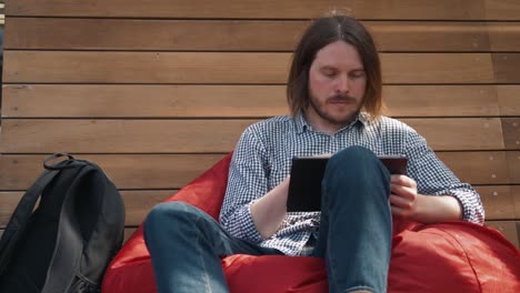 young-handsome-fashion-model-businessmen-using-tablet-outdoors,-man-male-portrait-with-tablet-in-city-work