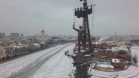 Moscow-winter-cityscape-with-river-and-Peter-the-Great-Statue,-aerial