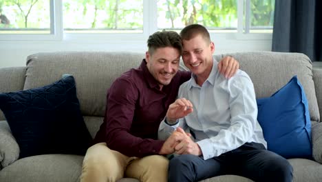 Gay-man-propose-to-his-boyfriend.-Holding-hands-together.