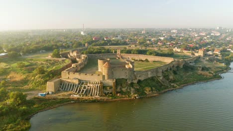 Aerial-view-of-the-Old-fortress-in-Belgorod-Dniester-at-Sunrise,-Ukraine