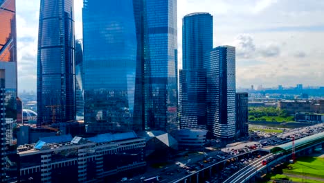 City-car-traffic-and-trains-ground-metro-arrive-on-the-platform-near-Moscow-city