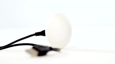 Chord-connected-to-easter-eggs-on-white-background