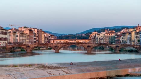 Scenic-Sunset-Skyline-timelapse-View-of-Tuscany-City,-Housing,-Buildings-and-Ponte-alla-Carraia-and-Arno-River,-Florence,-Italy