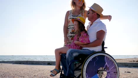 family-life-happy-pregnant-woman-with-little-girl-and-handicapped-person