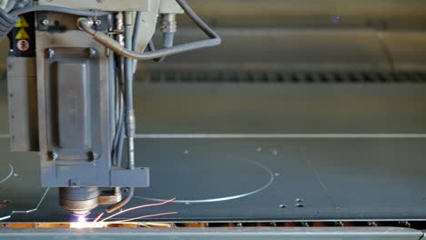 Laser-cut-machine-while-cutting-the-sheet-metal-with-sparks-and-high-precision