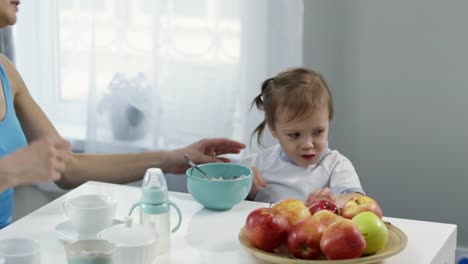 Female-Couple-Calming-Daughter-Refusing-to-Eat-Breakfast